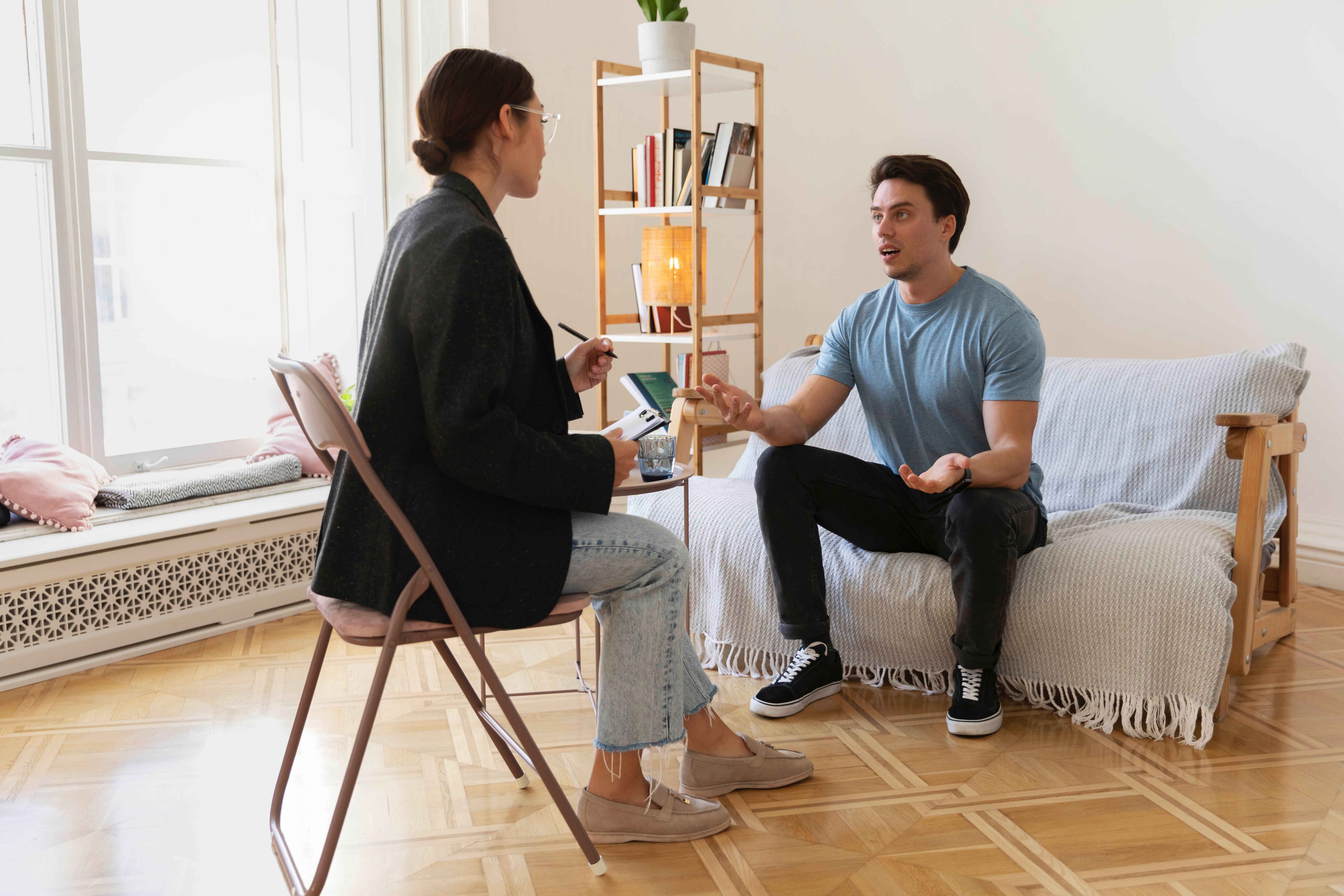 Therapist talking with client